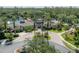 Luxurious community center featuring a pool, clubhouse, and lush landscaping with palm trees at 27528 Water Ash Dr, Wesley Chapel, FL 33544