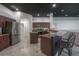 Bright kitchen with granite countertops, stainless steel appliances, and a convenient breakfast bar at 27528 Water Ash Dr, Wesley Chapel, FL 33544