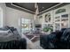 A stunning living room featuring a fireplace and view of the pool at 27528 Water Ash Dr, Wesley Chapel, FL 33544
