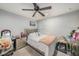 This bedroom features a light colored bed with a pink throw blanket at 2844 Jacob Crossing Ln, Holiday, FL 34691