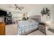 This bedroom features a ceiling fan and a bed with blue accents at 2844 Jacob Crossing Ln, Holiday, FL 34691