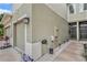 Exterior view of townhome showing stucco, garage, and entry with decorative rock bed at 2844 Jacob Crossing Ln, Holiday, FL 34691
