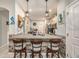 Kitchen with a bar, granite countertops, stainless steel appliances, and seating for three at 2844 Jacob Crossing Ln, Holiday, FL 34691