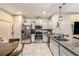 Kitchen featuring stainless appliances, granite countertops, and a breakfast nook area at 2844 Jacob Crossing Ln, Holiday, FL 34691