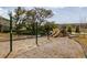 A charming community playground featuring swings and slides at 2844 Jacob Crossing Ln, Holiday, FL 34691