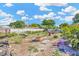 The backyard features a white fence, trees, and other items at 306 Brandywine Dr, Valrico, FL 33594