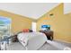 Bright bedroom featuring natural light, neutral-toned walls, and cozy carpeting at 306 Brandywine Dr, Valrico, FL 33594