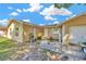Quaint single-story home featuring a tidy front yard and neutral stucco exterior under a bright blue sky at 306 Brandywine Dr, Valrico, FL 33594