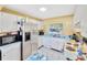 Functional kitchen with white cabinetry, stainless steel appliances, and ample counter space at 306 Brandywine Dr, Valrico, FL 33594