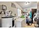 The laundry room features a washer, dryer, water heater, and tiled floors at 306 Brandywine Dr, Valrico, FL 33594