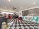 Finished basement with black and white checkered floors, table, and neon lights at 308 Cedar Ln, Largo, FL 33770