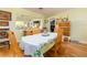 Bright dining room featuring hardwood floors, a table set for four, and natural light from the adjacent room at 308 Cedar Ln, Largo, FL 33770