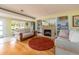 Cozy living room features a fireplace, built-in shelves, and hardwood floors, creating a warm atmosphere at 308 Cedar Ln, Largo, FL 33770