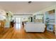Bright living room with hardwood floors, built-in shelves, and direct access to the foyer for easy access at 308 Cedar Ln, Largo, FL 33770