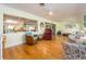 Open-concept living room featuring hardwood floors and plenty of seating at 308 Cedar Ln, Largo, FL 33770