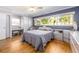 Well-lit main bedroom features a spacious layout with ample closet space and a large window at 308 Cedar Ln, Largo, FL 33770