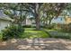 Beautiful backyard with manicured lawn and lush landscaping at 3315 W Hawthorne Rd, Tampa, FL 33611
