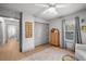 Bright Bedroom featuring wood floors, a ceiling fan, closet, and neutral decor at 3315 W Hawthorne Rd, Tampa, FL 33611