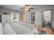 Bright bedroom with natural light, modern ceiling fan, ensuite bath and walk-in closet access at 3315 W Hawthorne Rd, Tampa, FL 33611