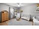 Cozy Bedroom with white crib, glider, area rug, and ample natural light at 3315 W Hawthorne Rd, Tampa, FL 33611