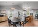 Open floor plan featuring a well-equipped kitchen with bar stool seating and a dining area at 3315 W Hawthorne Rd, Tampa, FL 33611