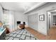 Well-lit office featuring a desk, a plush rug, a closet and a large window at 3315 W Hawthorne Rd, Tampa, FL 33611