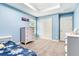 Bedroom features light blue walls, carpet, modern furniture, and a tray ceiling at 3503 W Price Ave, Tampa, FL 33611
