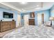 A beautifully decorated bedroom with neutral colored furniture, carpet flooring and easy access to the Primary bath and closet at 3503 W Price Ave, Tampa, FL 33611