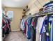 Spacious walk-in closet with extensive shelving and hanging space for organized storage at 3503 W Price Ave, Tampa, FL 33611