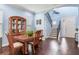 Dining room area features a wooden table set, china cabinet, hardwood floors, and natural light at 3503 W Price Ave, Tampa, FL 33611