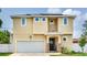 Charming two-story home featuring a welcoming front entrance and attached two-car garage at 3503 W Price Ave, Tampa, FL 33611