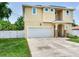 Charming two-story home with a well-maintained lawn and a spacious two-car garage at 3503 W Price Ave, Tampa, FL 33611