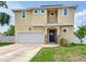 Stunning two-story home featuring a manicured front lawn and a welcoming front entrance at 3503 W Price Ave, Tampa, FL 33611