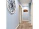 Hallway with light blue walls, carpet flooring, recessed lighting, and decorative wall art at 3503 W Price Ave, Tampa, FL 33611