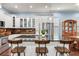 Kitchen features white cabinets, granite counters, stainless appliances, breakfast bar, and decorative backsplash at 3503 W Price Ave, Tampa, FL 33611