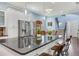Large kitchen island with barstool seating, stainless steel appliances, and ample cabinet space at 3503 W Price Ave, Tampa, FL 33611