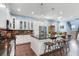 Spacious kitchen with stainless steel appliances and a large island with bar stools at 3503 W Price Ave, Tampa, FL 33611