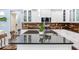Modern kitchen with granite countertops, white cabinets, stainless-steel appliances, and island at 3503 W Price Ave, Tampa, FL 33611