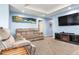 Spacious living room with comfortable seating and a media center at 3503 W Price Ave, Tampa, FL 33611