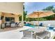 Spacious patio with a dining table, umbrella, and view of the swimming pool at 3503 W Price Ave, Tampa, FL 33611