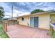 Relax on this beautiful wood deck right off the main house with sliding doors at 40019 Pretty Redbird Rd, Zephyrhills, FL 33540