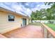 Enjoy relaxing on the outdoor deck overlooking the spacious yard, and mature trees at 40019 Pretty Redbird Rd, Zephyrhills, FL 33540