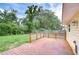 Enjoy the shade of the mature trees in this large, grassy backyard with wooden deck at 40019 Pretty Redbird Rd, Zephyrhills, FL 33540