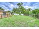 Well-maintained and spacious backyard with a mix of fencing and mature trees at 40019 Pretty Redbird Rd, Zephyrhills, FL 33540