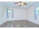 Neutral paint and hardwood floors makes this bedroom move-in ready at 40019 Pretty Redbird Rd, Zephyrhills, FL 33540