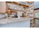 Well-equipped kitchen with granite countertops, stainless steel appliances, and a stylish breakfast bar at 40019 Pretty Redbird Rd, Zephyrhills, FL 33540