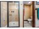 Updated bathroom featuring a tiled shower with glass door and separate toilet room at 4400 English Turn Way, Wesley Chapel, FL 33543