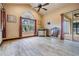 Bright primary bedroom with tile floors and sliding glass door to the screened patio at 4400 English Turn Way, Wesley Chapel, FL 33543