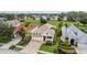 Charming single Gathering home with two-car garage, paver driveway, tropical landscaping, and covered porch at 4400 English Turn Way, Wesley Chapel, FL 33543