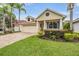 Charming home with a well-manicured lawn, lush landscaping, and a welcoming paver driveway, set in a desirable neighborhood at 4400 English Turn Way, Wesley Chapel, FL 33543
